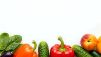Fresh organic vegetables and fruits border on white background with copy space for healthy eating and nutrition concepts.