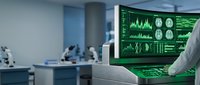 Medical professional analyzing brain scan data on computer monitor in modern healthcare facility with advanced diagnostic equipment.