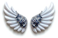 White angel wings decorated with blue and clear crystals on isolated background, luxury fashion accessory design element for creative projects.