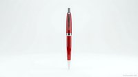 Red ballpoint pen isolated on white background for office supplies and writing instruments design projects.