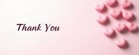 Pink heart-shaped candies scattered on soft pink background with Thank You text, creating minimal romantic composition for greeting cards and social media posts.