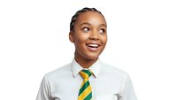 Happy young African American female student in white school uniform shirt with green yellow striped tie looking up with bright smile isolated on white background.