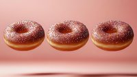 Levitating chocolate glazed donuts with sparkly sugar sprinkles on pink background, floating in row. Sweet pastry dessert concept for bakery and confectionery design.