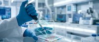 Scientist in blue gloves using pipette for precise liquid handling in modern laboratory for medical research and scientific experiments.