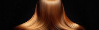 Smooth flowing brown hair on dark background showcasing healthy, straight, shiny locks with natural ombre effect. Professional salon and beauty concept.