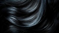 Luxurious dark black hair with silver highlights flowing in smooth waves creates dramatic contrast and shine, showcasing healthy, silky texture and movement.