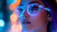 Young Asian woman wearing transparent glasses illuminated by vibrant neon lights creating futuristic cyberpunk atmosphere with blue and orange bokeh effects in background.