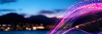 Vibrant purple and pink light trails create dynamic motion against twilight cityscape background, glowing particles and bokeh effects add magical atmosphere.