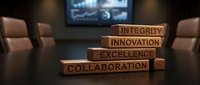 Wooden blocks with corporate values stacked in boardroom setting with blurred presentation screen background for business leadership and company culture concepts.
