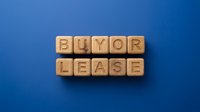 Wooden blocks spelling "HUMOR LEASE" arranged on a solid blue background, suitable for business, marketing, and editorial content.