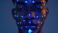Young African woman's face illuminated by glowing blue dots in dark atmosphere, creating futuristic beauty portrait with luminescent makeup effect and serene expression.