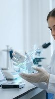 Female scientist in white lab coat holding glowing DNA double helix hologram in modern laboratory with microscope and research equipment in background.