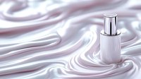 Luxury cosmetic bottle on silky pearl white fabric with elegant waves and folds creating soft flowing texture. Minimalist beauty product presentation.