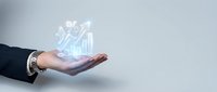 Businessman hand holding glowing holographic financial growth chart with upward arrow, representing digital investment, data analytics, and business success on isolated background.