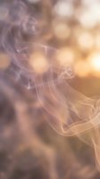 Ethereal smoke swirls with warm golden bokeh lights creating dreamy atmospheric background for luxury spa wellness meditation and relaxation concepts.