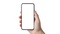 Hand holding modern smartphone with blank white screen mockup isolated on white background for app presentation and mobile interface design.