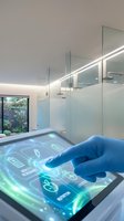 Scientist wearing blue latex glove interacting with holographic touchscreen display in modern laboratory bathroom with frosted glass partitions and integrated LED lighting, suitable for healthcare technology and medical innovation concepts.