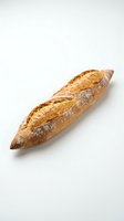 Fresh artisan baguette with golden crust isolated on white background for bakery and food design projects.
