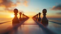 Chess pawns silhouetted against golden sunset sky, standing in two parallel rows on reflective surface, creating dramatic perspective and symbolizing strategy.