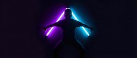 Silhouette of person with glowing purple and blue neon lights creating dramatic wings effect against dark background for creative projects.