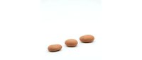 Three brown oval pills or tablets arranged in ascending size order on white background for medical and pharmaceutical design projects.