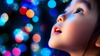 Young Asian girl looking up with wonder at colorful bokeh lights creating magical atmosphere for holiday celebrations and festive decorations.