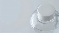 Minimalist white cosmetic jar on light background with soft shadows, elegant packaging design for luxury skincare and beauty products presentation.