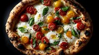 Artisan pizza with colorful cherry tomatoes, fresh mozzarella and basil leaves on rustic wood-fired crust against dark background for food photography.