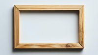 Minimalist wooden picture frame on light gray wall background, empty space for artwork or photo display. Clean modern design element isolated.