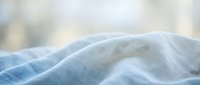 Close-up of soft, lightweight linen fabric with natural texture and gentle folds, suitable for textile design, fashion, home decor, and material sourcing.