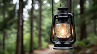 Vintage oil lantern glowing warmly in misty forest setting, creating atmospheric outdoor camping and adventure mood for rustic wilderness experiences.
