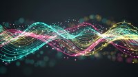 Abstract colorful wave lines with glowing particles and bokeh effects on dark background. Digital technology and data flow visualization concept.