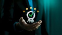 Professional hand presenting quality certification badge with green checkmark and golden stars representing excellence standards and business approval.