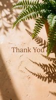 Thank you card with fern leaves and soft shadows on a warm beige textured wall, elegant natural aesthetic for greeting cards.