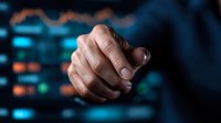 Close-up of male hand making fist gesture against dark background with blue technology interface lights, conveying power, determination and digital transformation.