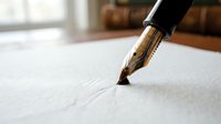 Elegant gold fountain pen nib touching white paper surface, ready for writing important documents, contracts, or creative literary work in office setting.