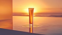 Cosmetic tube standing in water with ripple effect against golden sunset sky, creating luxurious mood for beauty and skincare advertising campaigns.