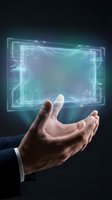 Male hand holding glowing digital holographic interface with circuit board patterns and data visualization elements against dark background for technology and innovation concepts.