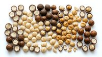 Assorted wooden beads collection in natural brown tones, perfect for jewelry making, crafts and DIY projects on white background.
