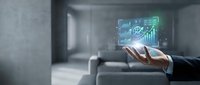 Businessman hand holding digital hologram with financial charts and growth graphs for business analytics and investment strategy planning.