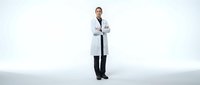 Young adult male healthcare professional with light skin tone wearing white lab coat and stethoscope, standing with arms crossed against neutral background for medical, clinical, and healthcare industry use.