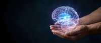 Human hands holding glowing digital brain with neural networks and electric connections on dark background for artificial intelligence concepts.
