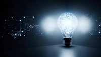 Glowing light bulb with digital network connections and data points on dark background representing innovation, technology and creative ideas in business.