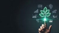 Businessman hand presenting glowing green plant with financial growth charts and data analytics icons for sustainable business development.