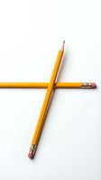 Two yellow wooden pencils with pink erasers crossed on white background isolated for education and office design concepts.