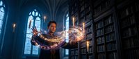 Young wizard casting magical spell with glowing energy streams in gothic library with ancient books and stained glass windows for fantasy gaming content.