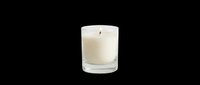 Cream scented candle in clear glass container with lit wick, isolated on transparent background. Ready for t-shirt design, clipart, stickers, print-on-demand, and sublimation projects.