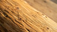 Weathered wood plank surface with natural grain patterns and rustic texture for carpentry and construction projects.