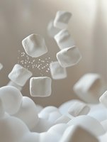 Soft white marshmallows floating in air with sugar dust particles against neutral beige background, creating dreamy atmospheric food composition for confectionery advertising.
