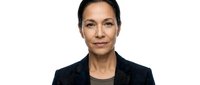 Professional middle-aged Hispanic businesswoman in dark suit jacket isolated on white background for corporate presentations and marketing materials.
